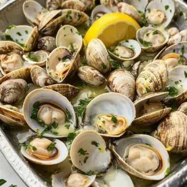 Savor Grilled Clams with Lemon, Parsley, Garlic and Butter Delight 9 Grilled Clams with Lemon, Parsley, Garlic and Butter