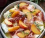 Indulge in Baked Brie with Peach, Prosciutto & Hot Honey Delight